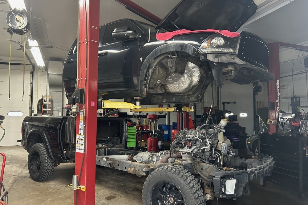 Auto Repair In Racine, WI At Durand Automotive. Front of a truck lifted in an auto repair shop