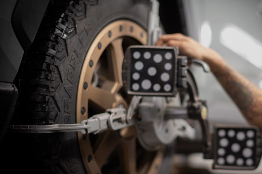 Japanese Cars Front-End Alignment Service in Racine WI At Durand Automotive. Close-up view of wheel alignment on a Japanese car at an auto repair shop