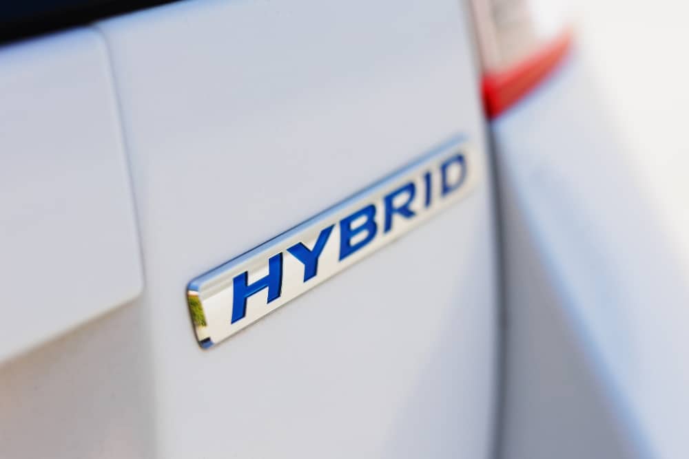 Hybrid Diagnostics for Toyota & Honda, Hybrid Maintenance in Racine WI At Durand Automotive. Close-up of Toyota Hybrid emblem on vehicle exterior