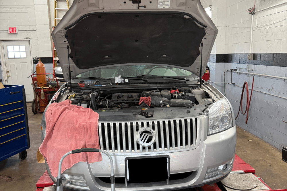 National Car Care Month in Racine, WI At Durand Automotive. Car with hood open during inspection at an auto repair shop
